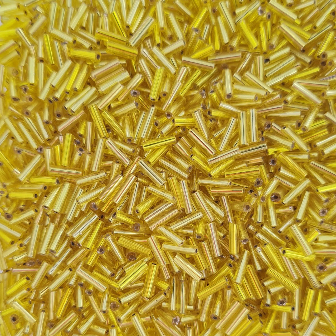 Gule glasperler, preciosa cut bugles, silverlined yellow, 6,8 mm Preciosa BOC